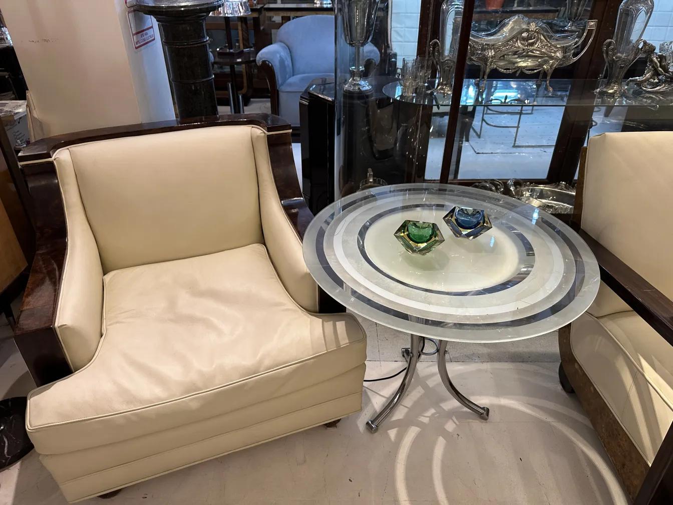 Antique Murano glass on a table with armchairs