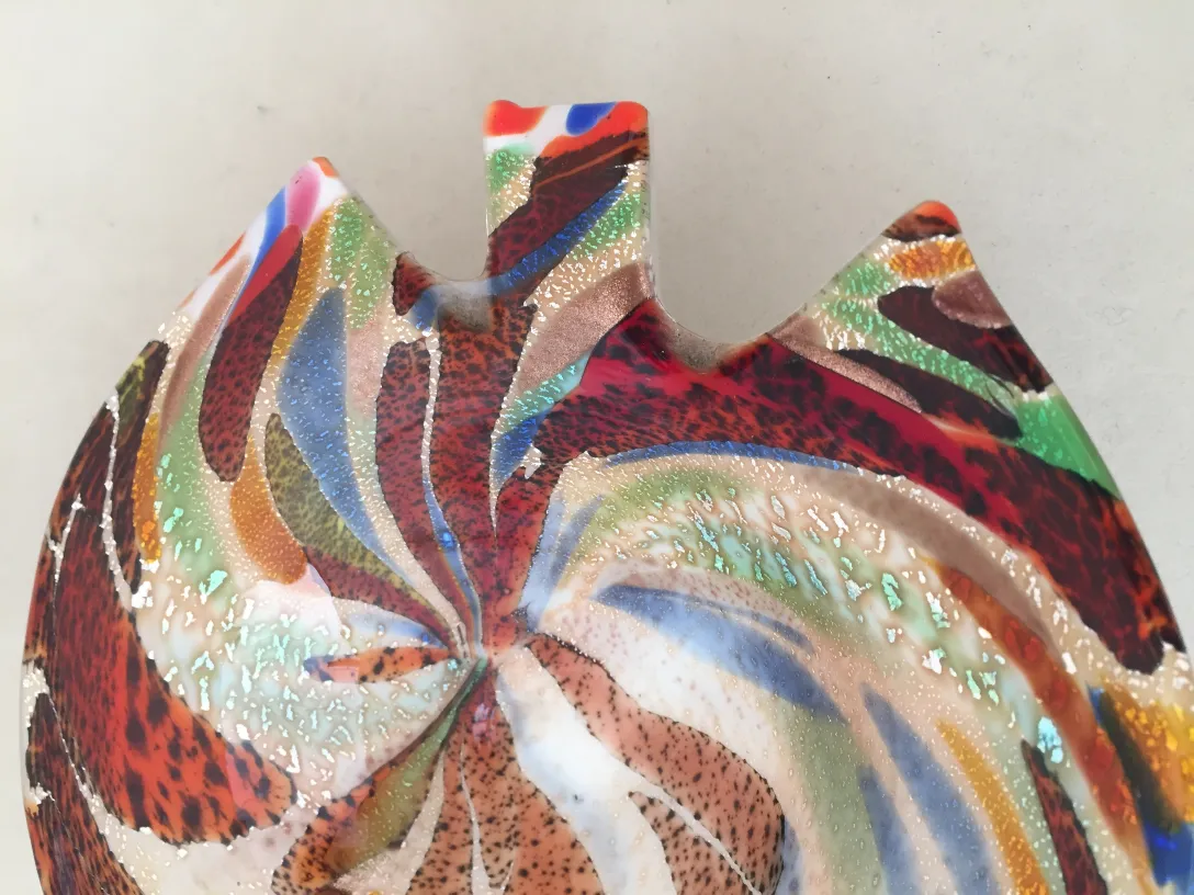 Antique Murano glass piece with colorful fluid patterns