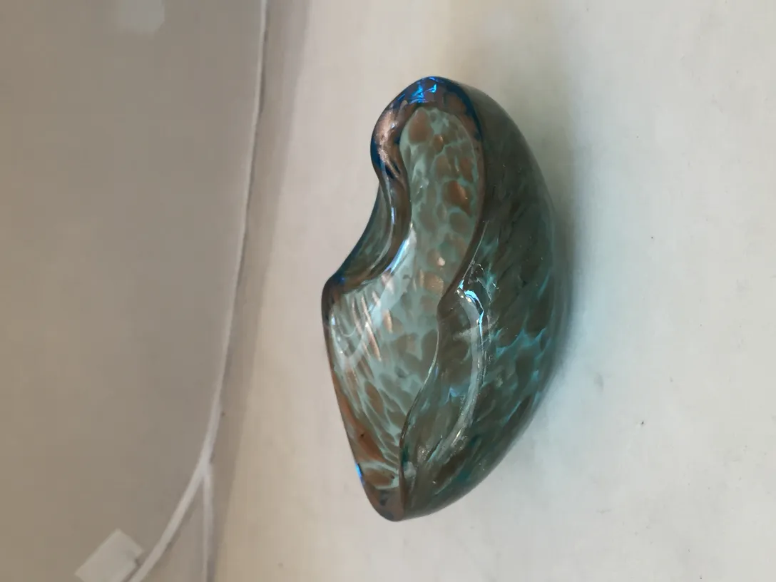 antique murano glass with wavy design and blue color