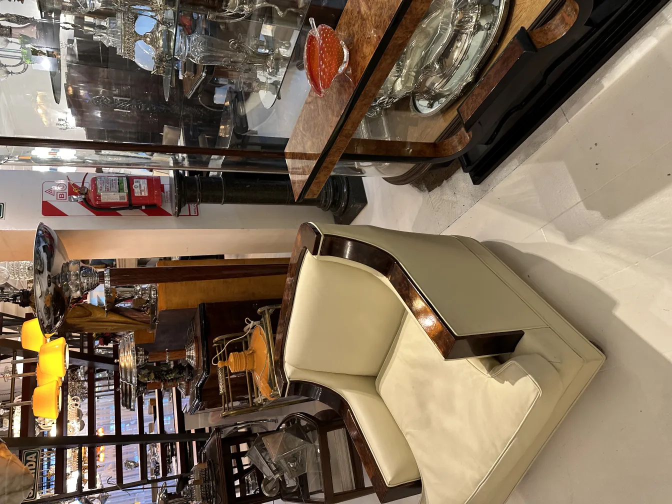 chair and antique murano glass items on display