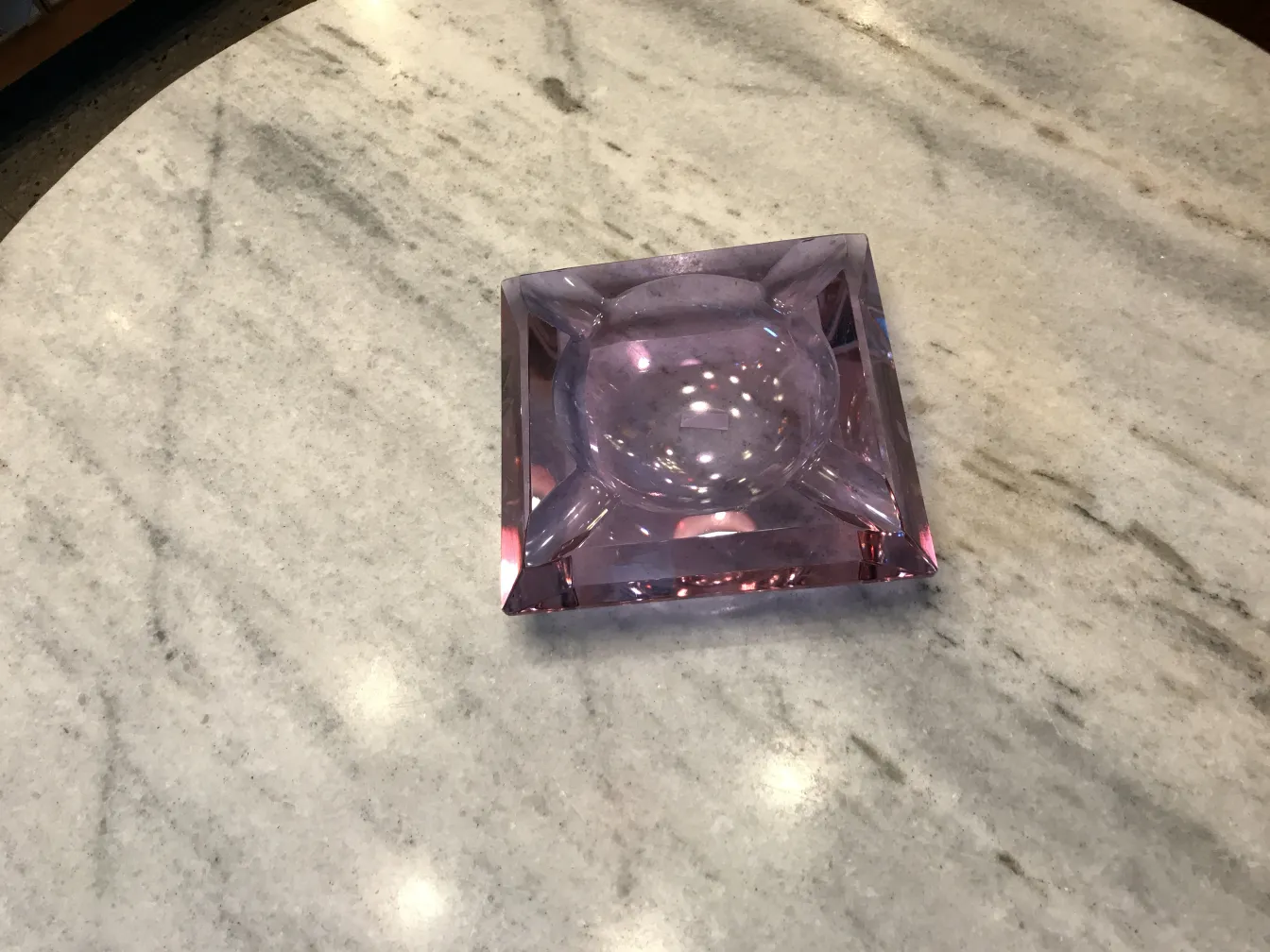antique murano glass in purple tones on light surface