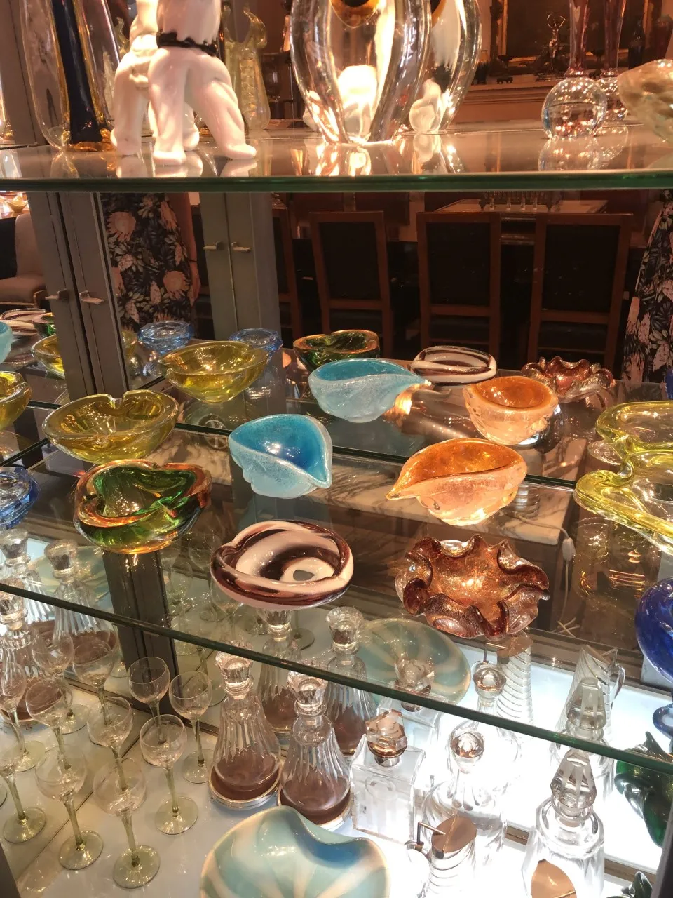various antique murano glass pieces with vibrant colors