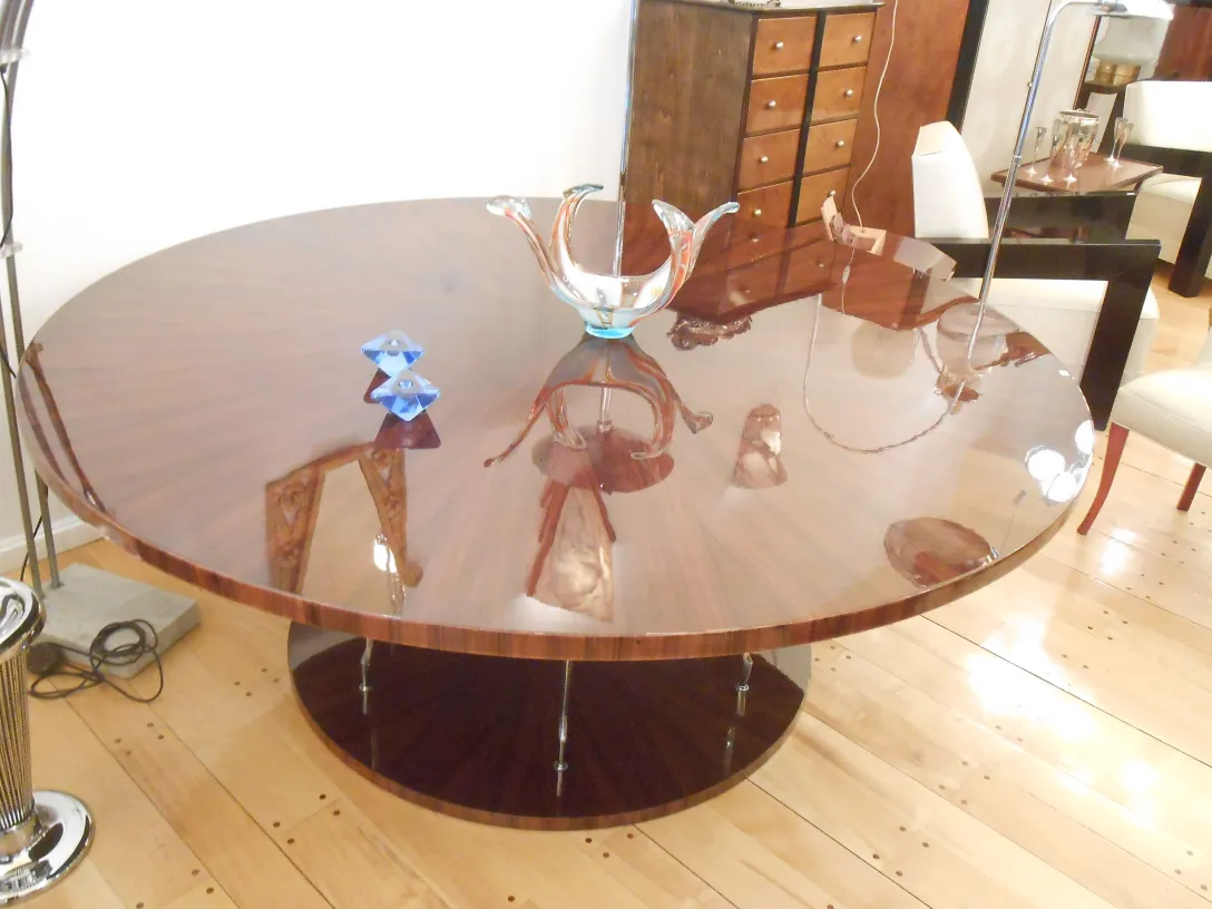 antique decorative murano glass piece in vibrant colors on a wooden table