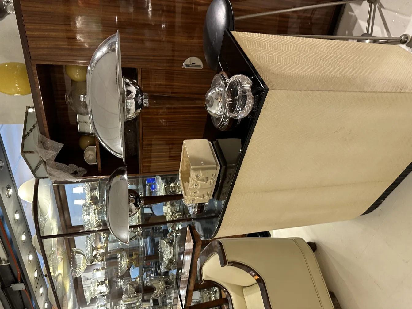 integration of murano glass in an elegant setting with decorative elements like lamps and wooden furniture