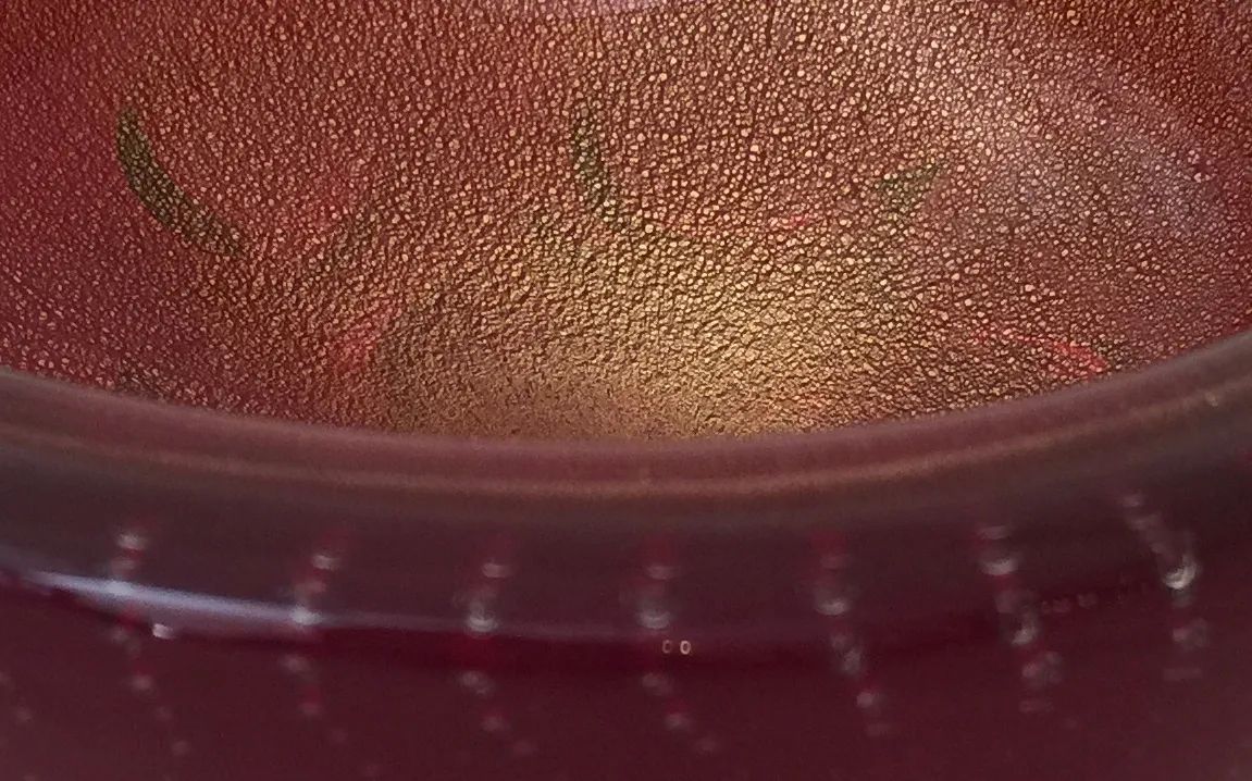 detail of an antique murano glass in vibrant colors with texture