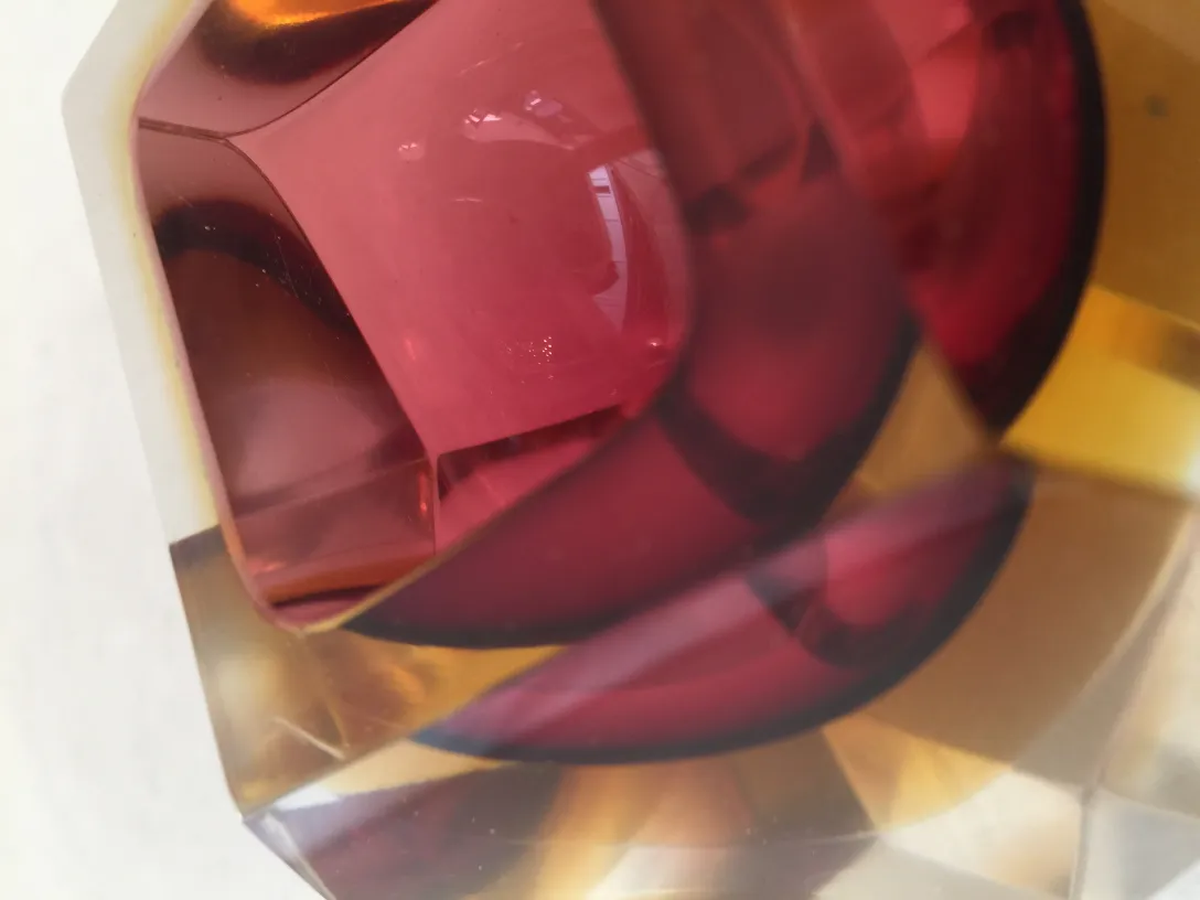 Antique Murano glass, colorful and shiny with geometric shapes.