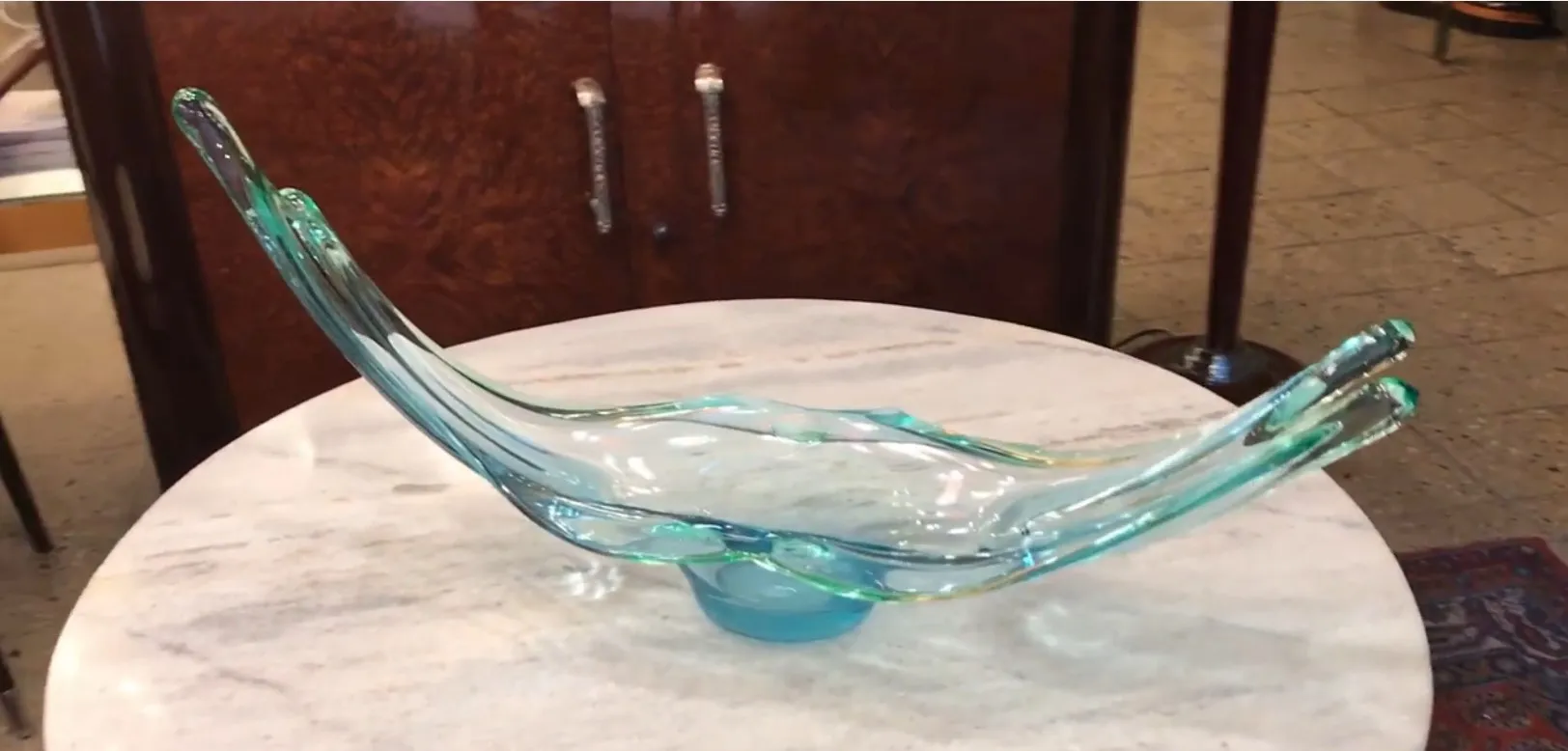 antique murano glass sculpture, featuring elegant curves and blue tint