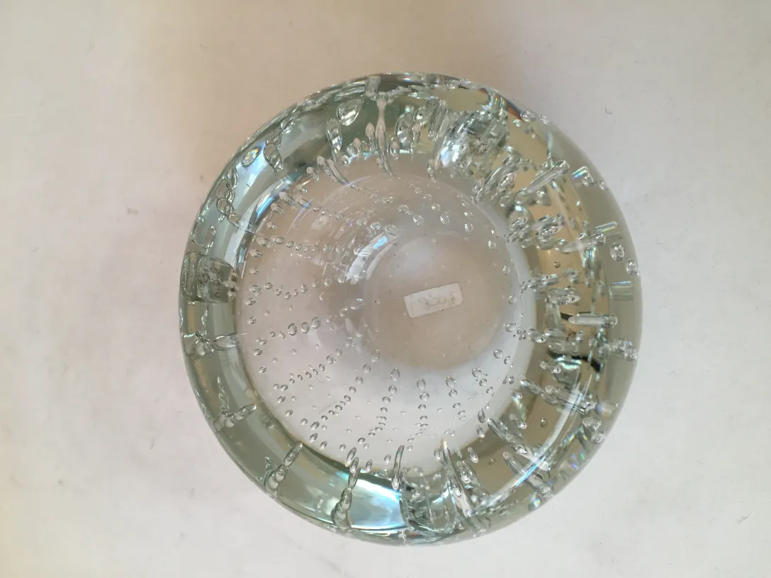 Antique Murano glass with bubbles on a neutral background