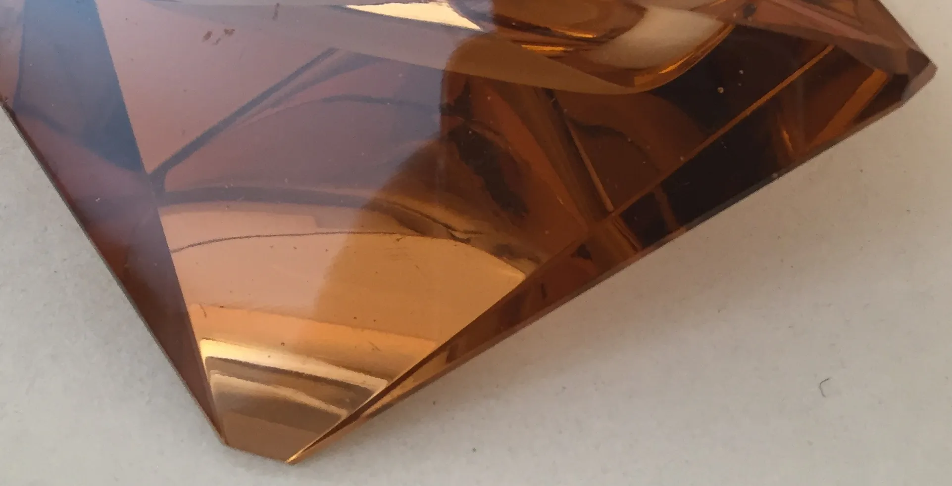 decorative figure of Murano glass, amber color, shines with light