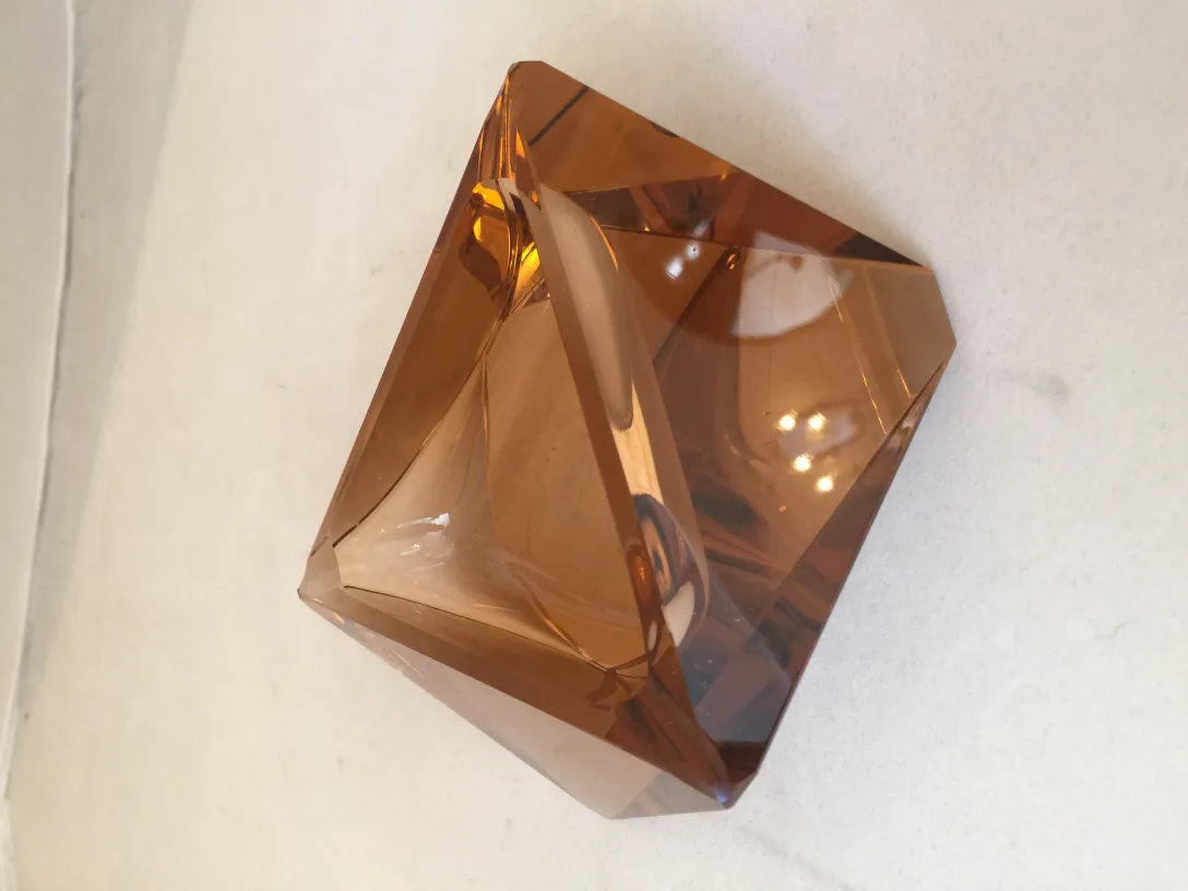 detail of antique murano glass with faceted shapes and amber color