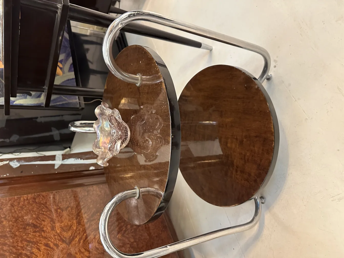 Antique Murano glass piece with decorative details in an elegant setting.