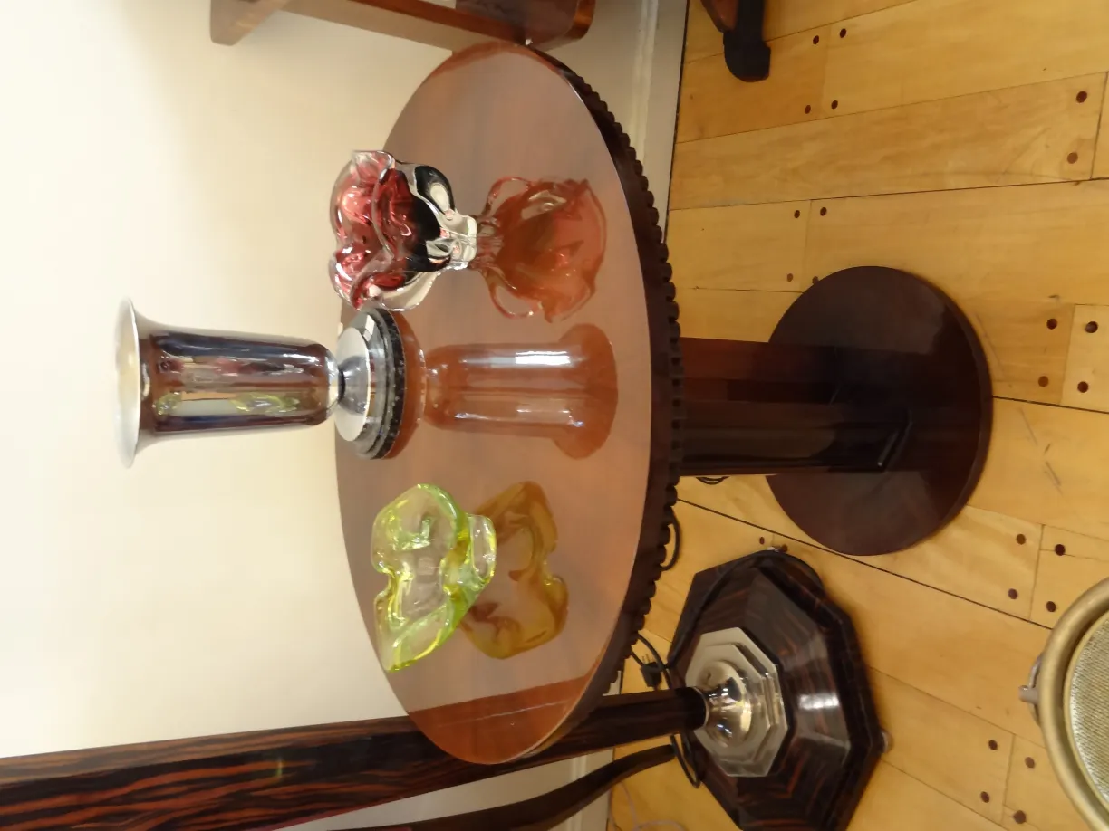 three antique murano glass vases on a table