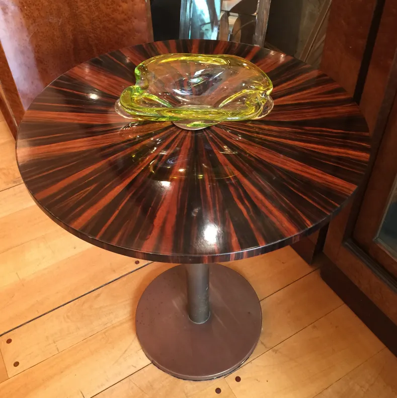 Antique Murano glass in fluid shape on table