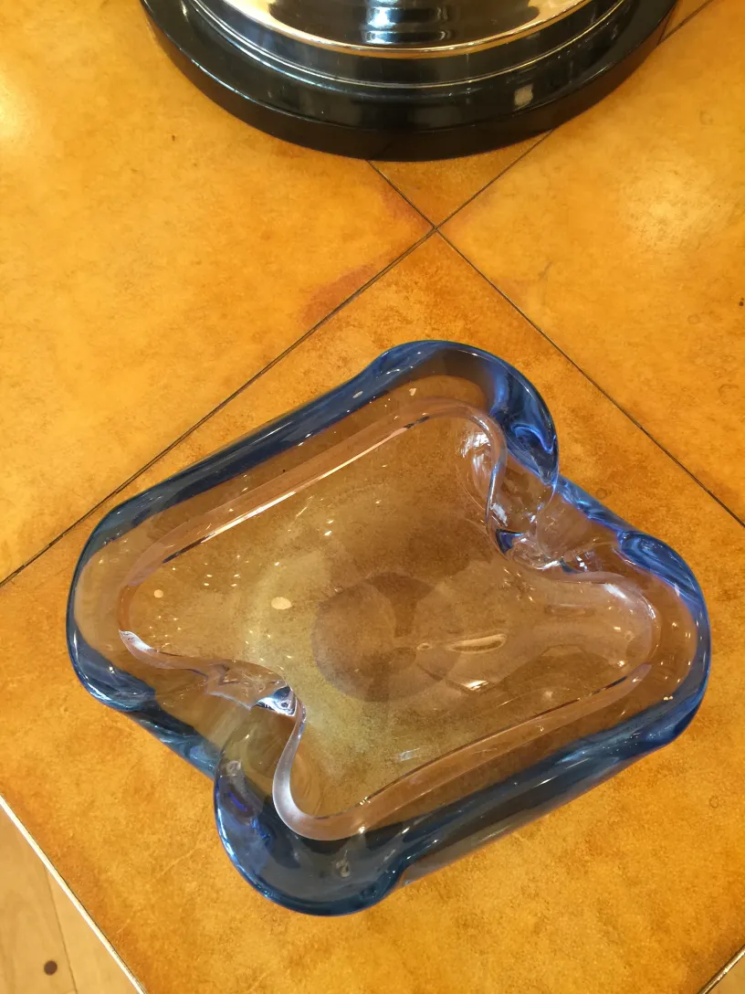 Blue Murano glass with decorative shape in an antique setting.