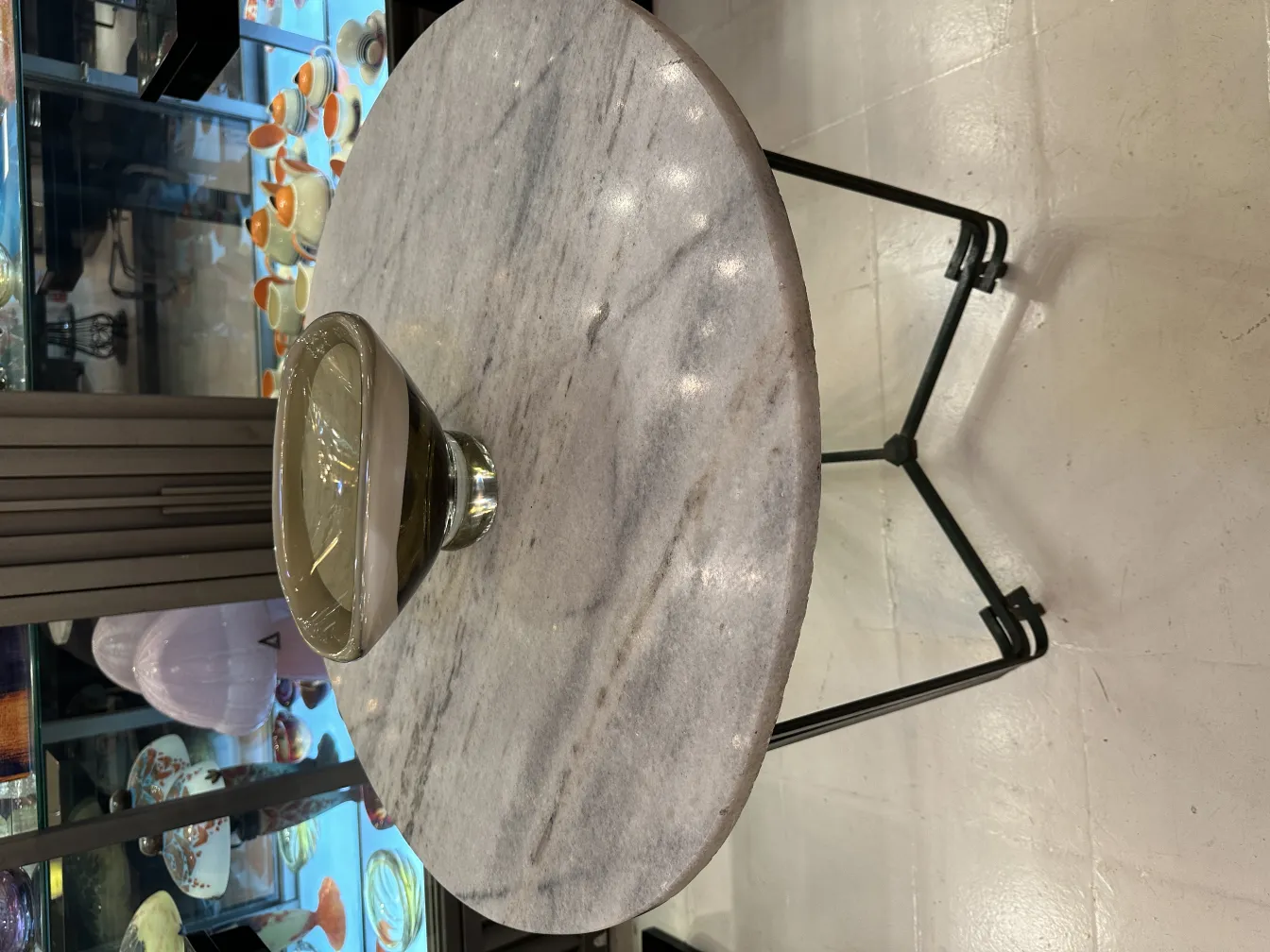 decorative murano glass with clear base and soft tones, background of antiques