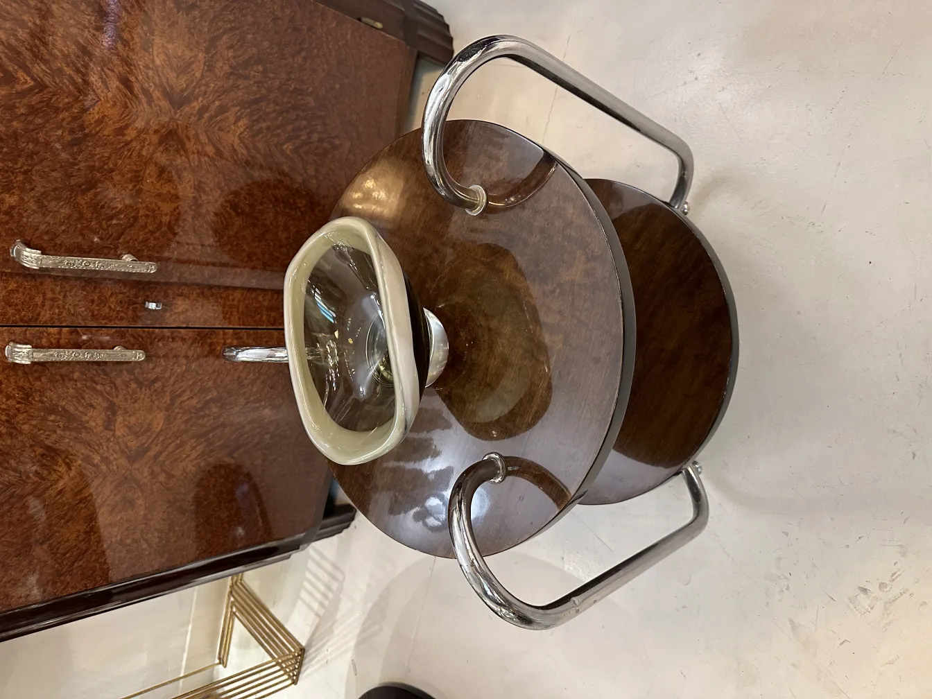 Elegant antique Murano glass with a shiny finish, surrounded by a classic setting.