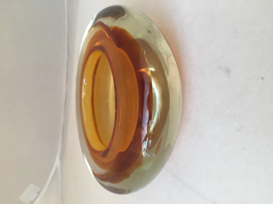Antique Murano glass in brilliant amber color, decorative.