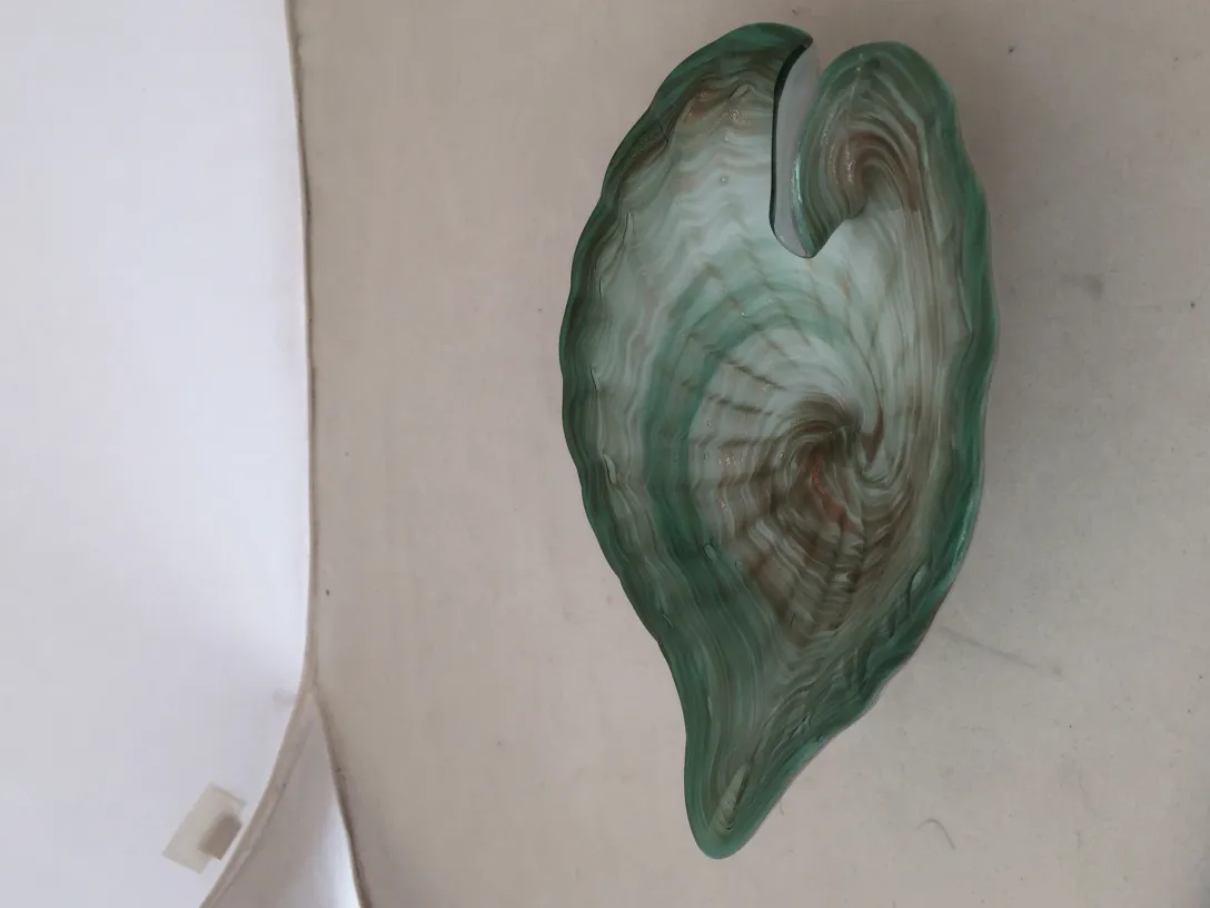 wide leaf-shaped sculpture in light green