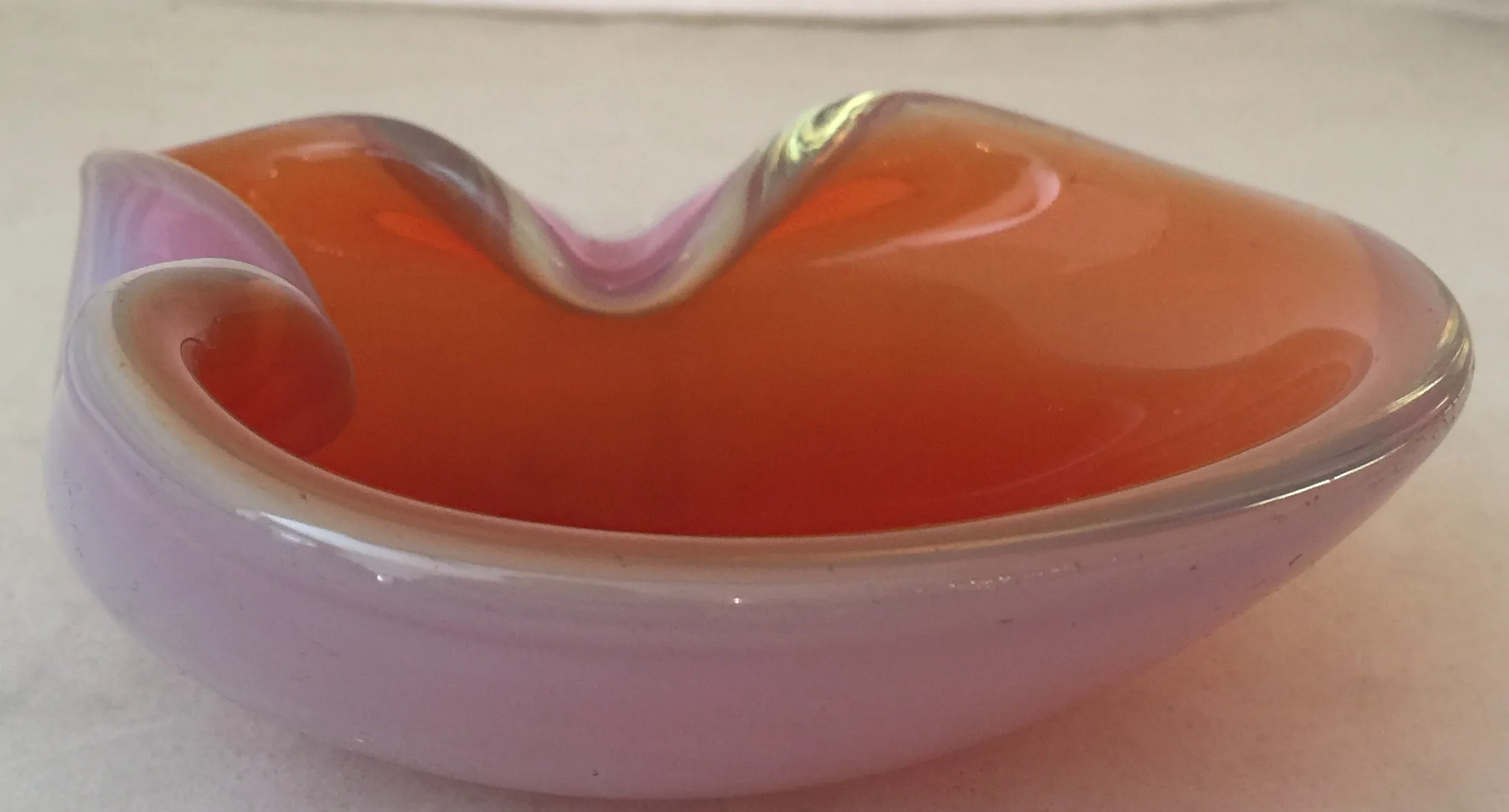 antique decorative murano glass plate in orange and pink hues