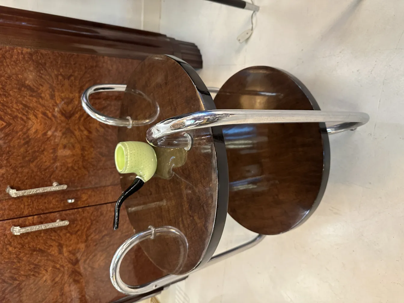 antique table with wooden base and shiny decorations