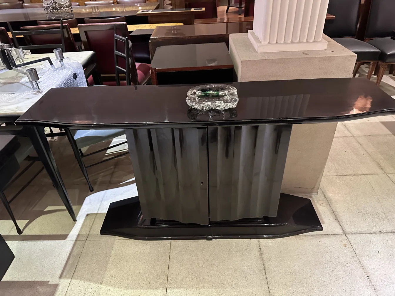 Antique Murano glass with decorative shape on table.