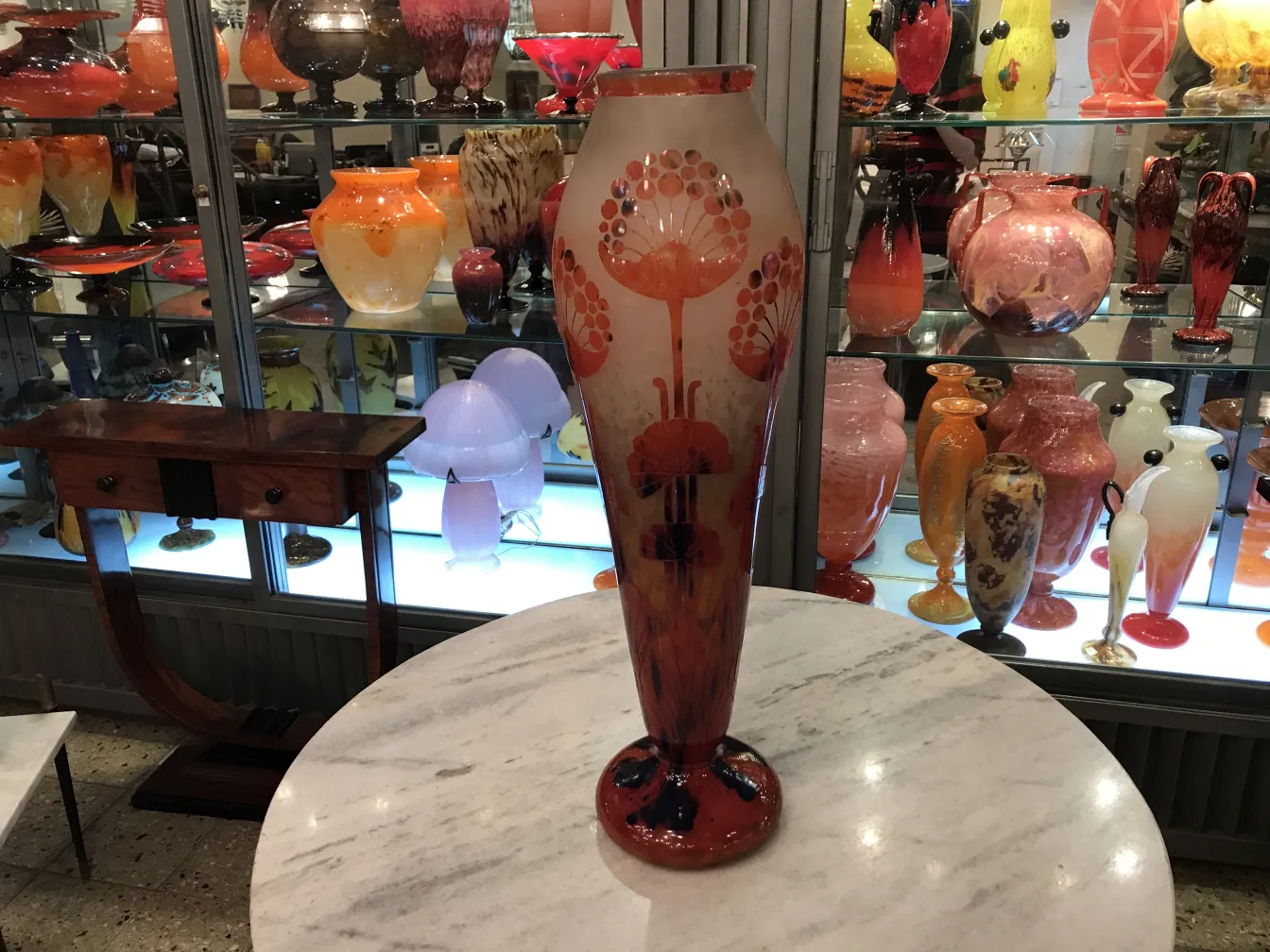 Decorative signed glass vase Le Verre in an antique setting.