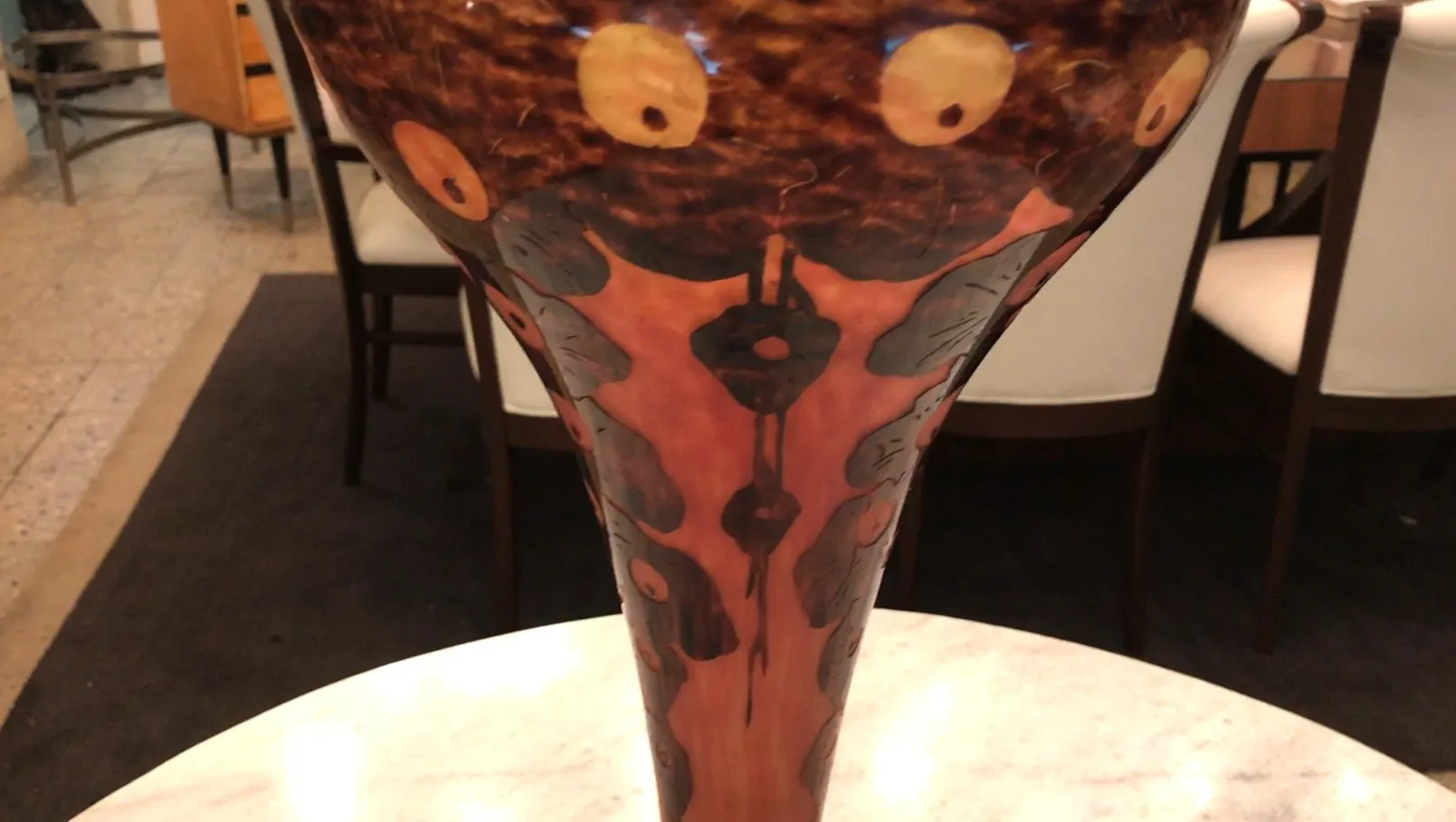 glass vase with decorative details and visible signature