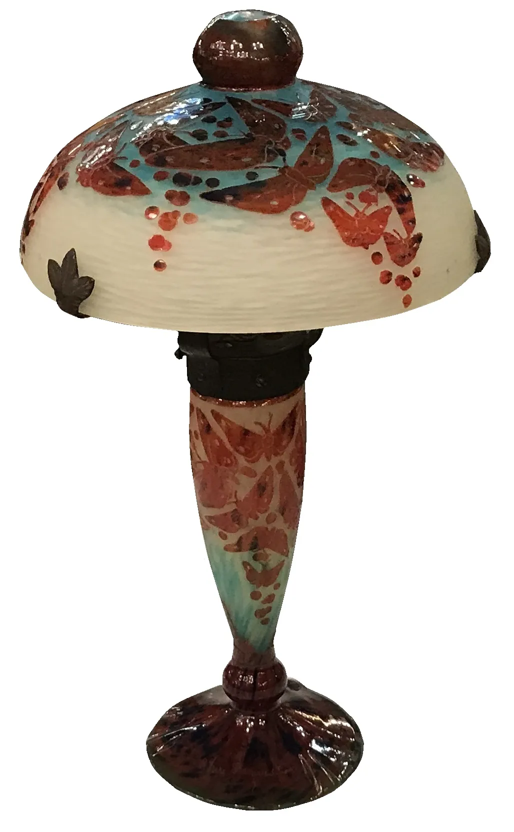 Antique signed glass lamp with decorative butterflies and elegant base.