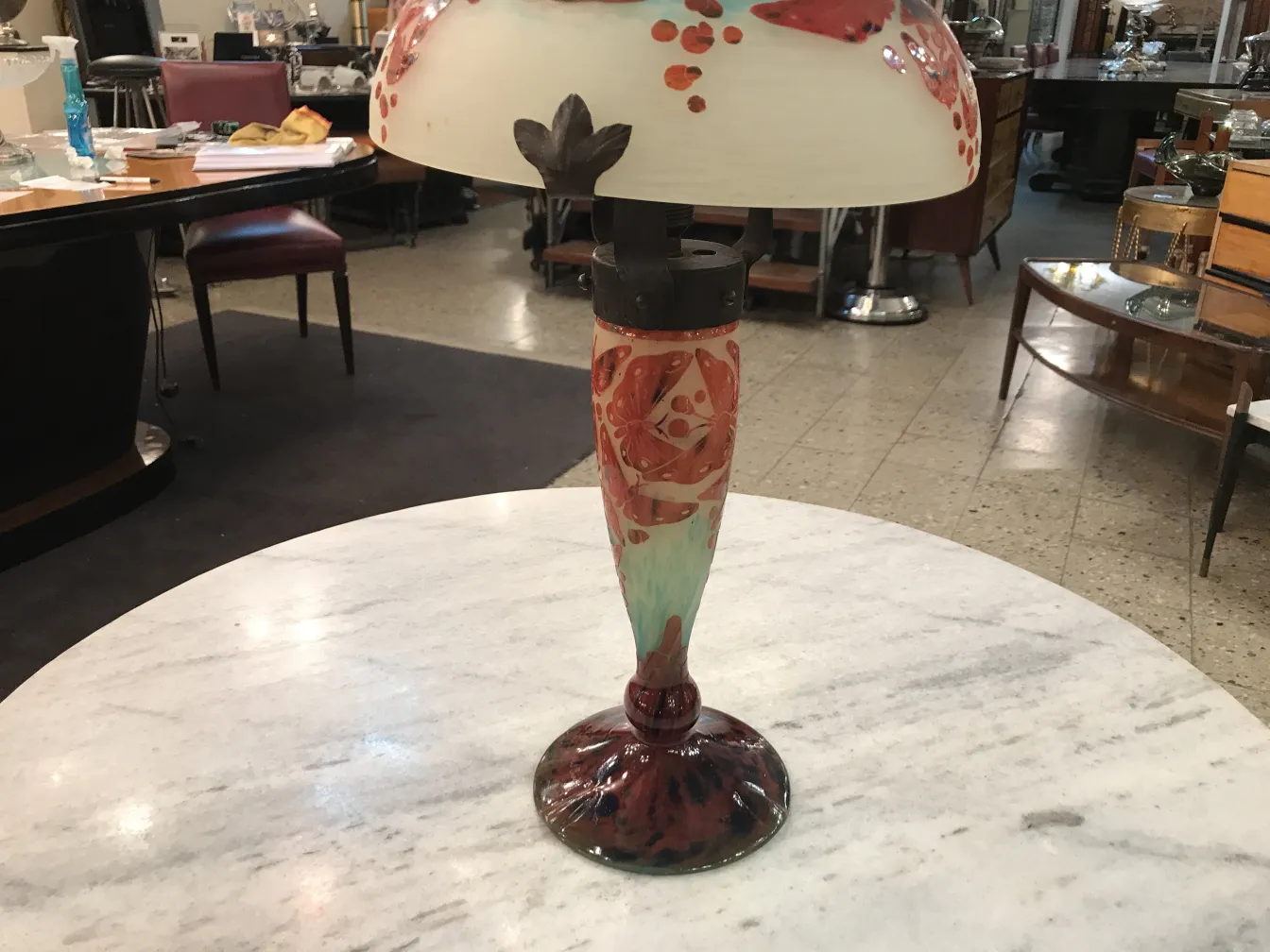 Antique lamp made of signed glass Le Verre, vivid colors, placed in a vintage setting