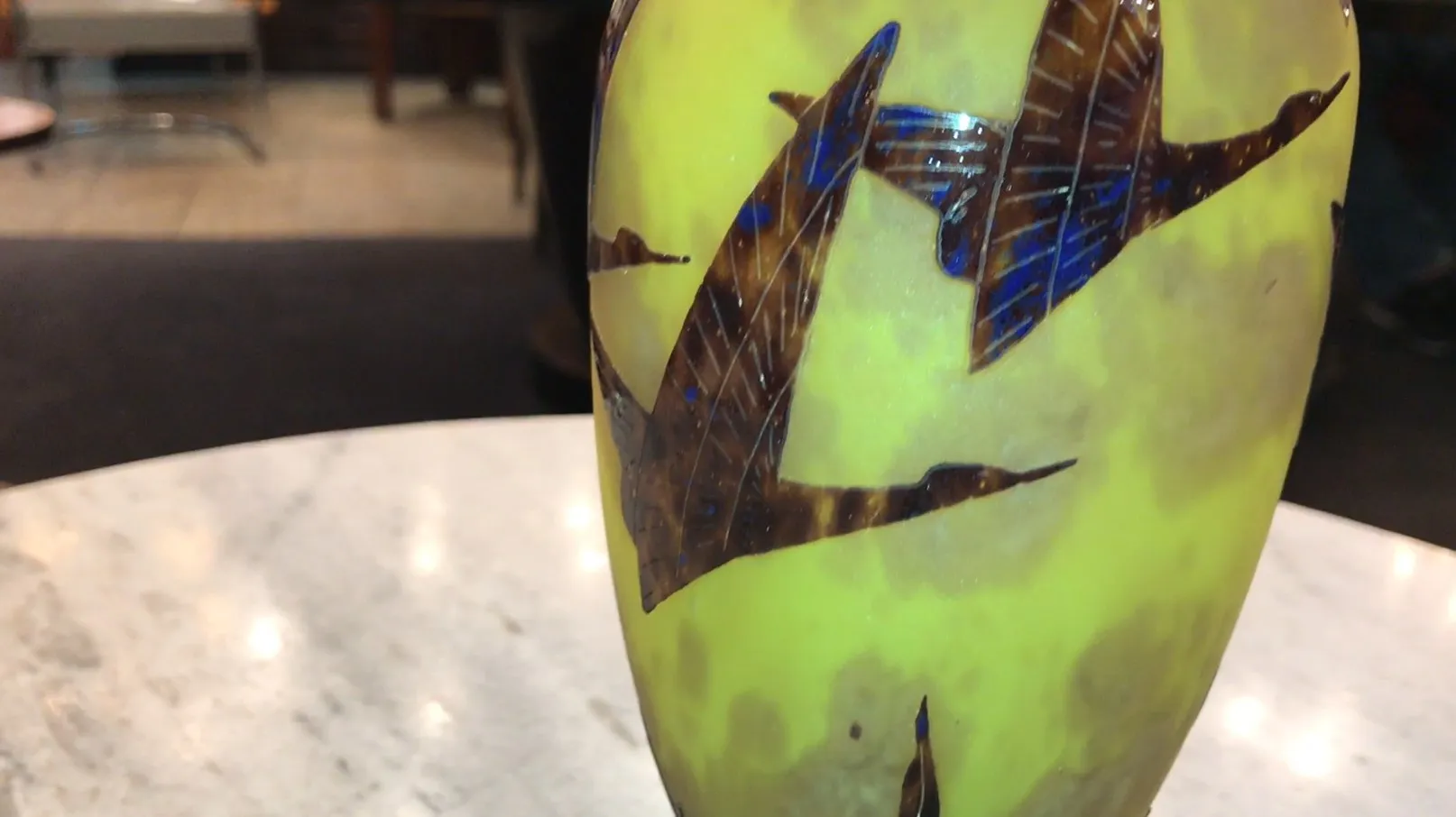 antique glass signed with bird designs in yellow and brown tones