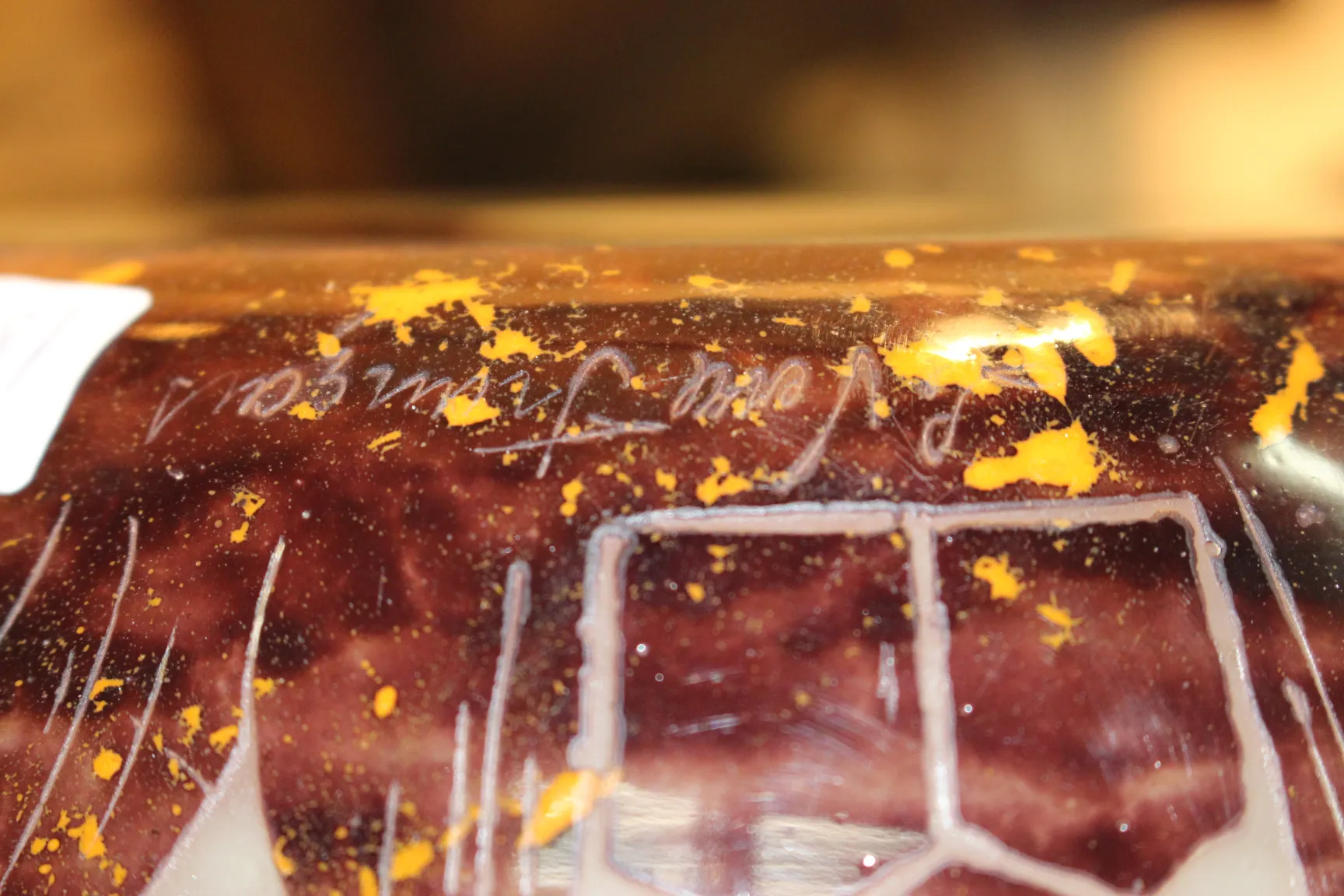 Antique signed glass with yellow and brown details.