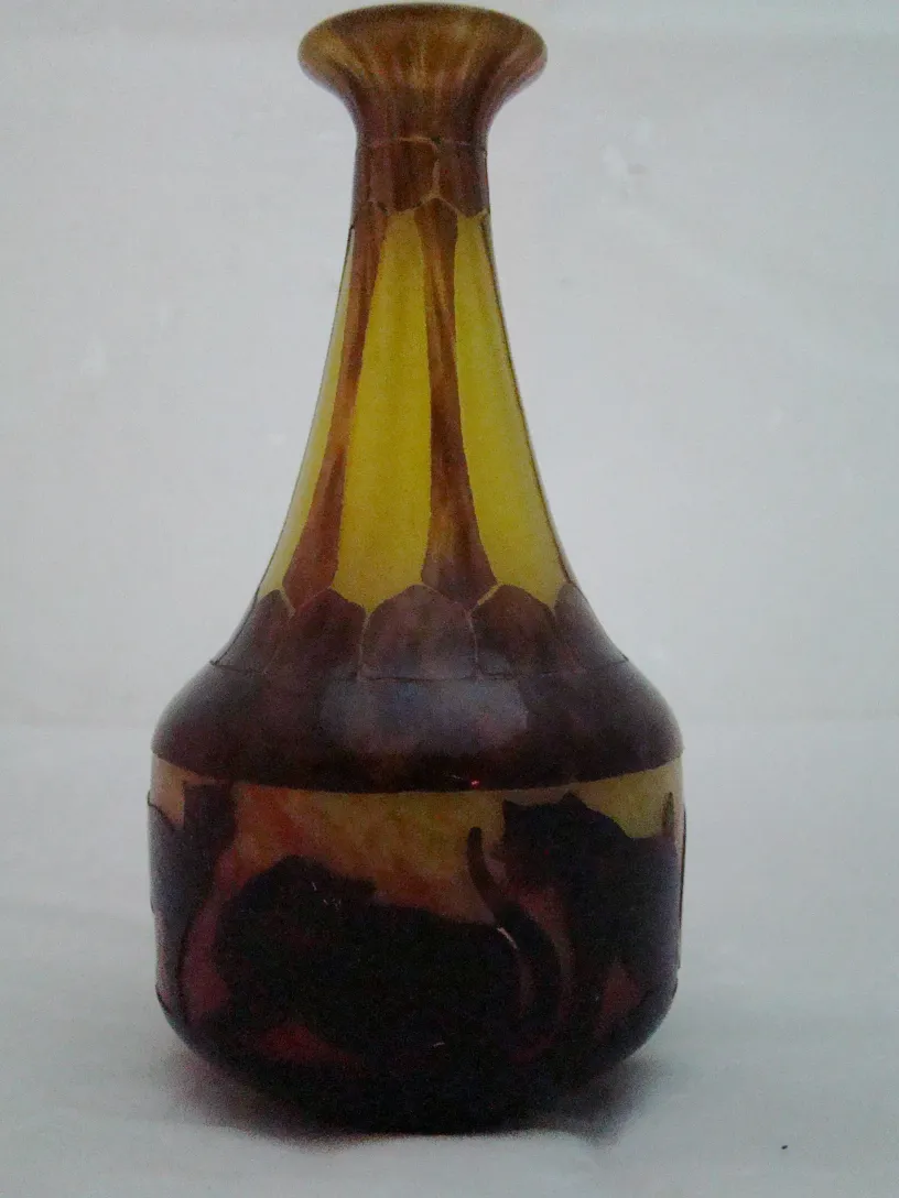 Antique signed glass with cat designs and amber hues.