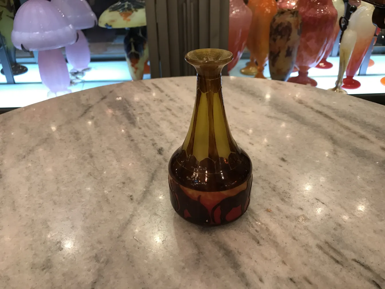 Antique signed glass featuring elegant amber tones.