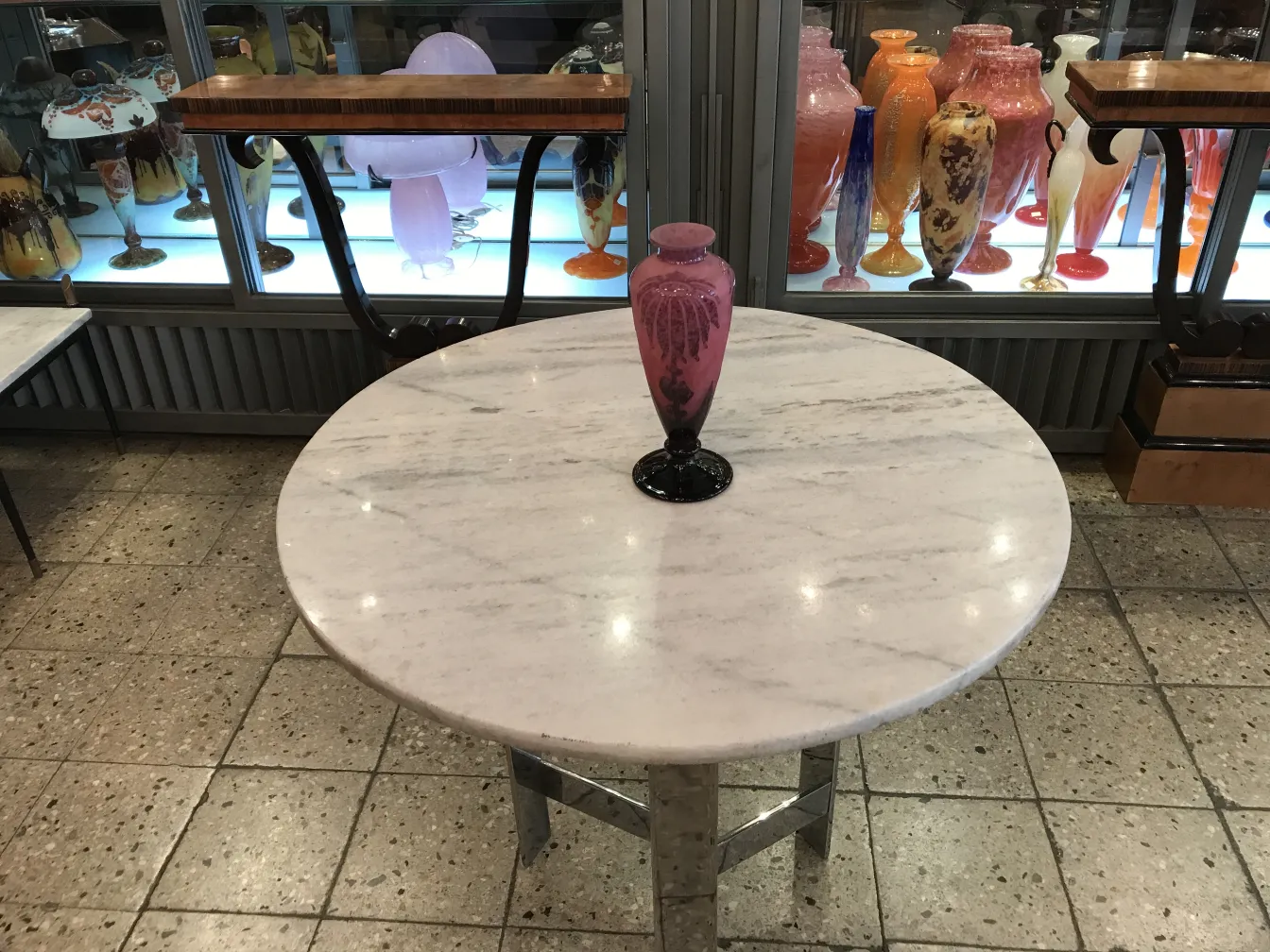 signed glass Le Verre on marble table with antique items
