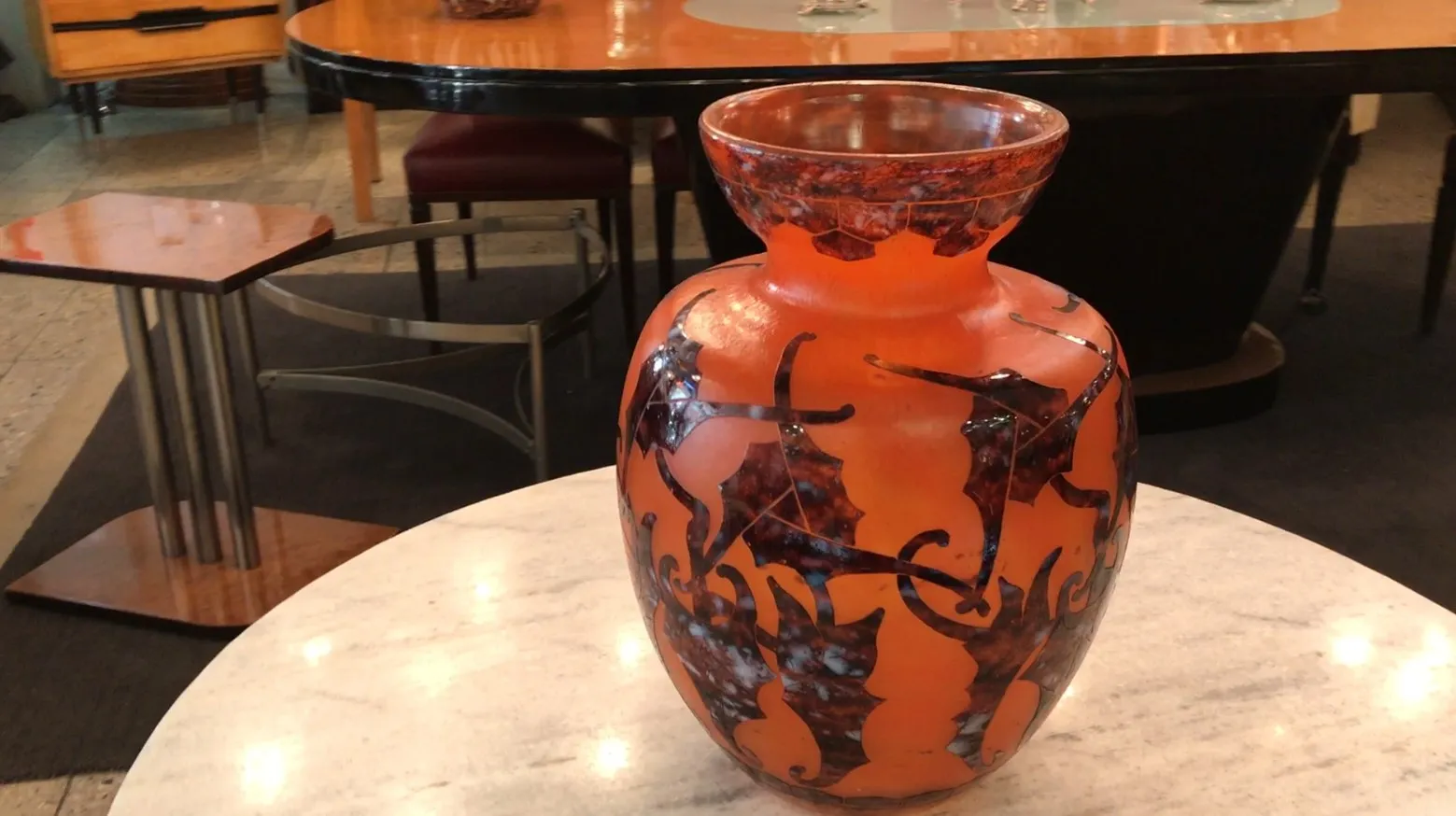 Vase of signed glass Le Verre with decorative design on orange background