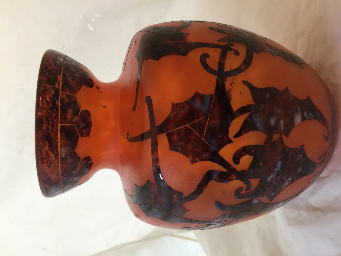antique glass vase with organic design in orange and brown hues