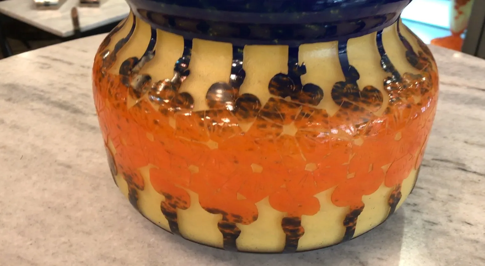 Antique signed glass with vibrant color patterns