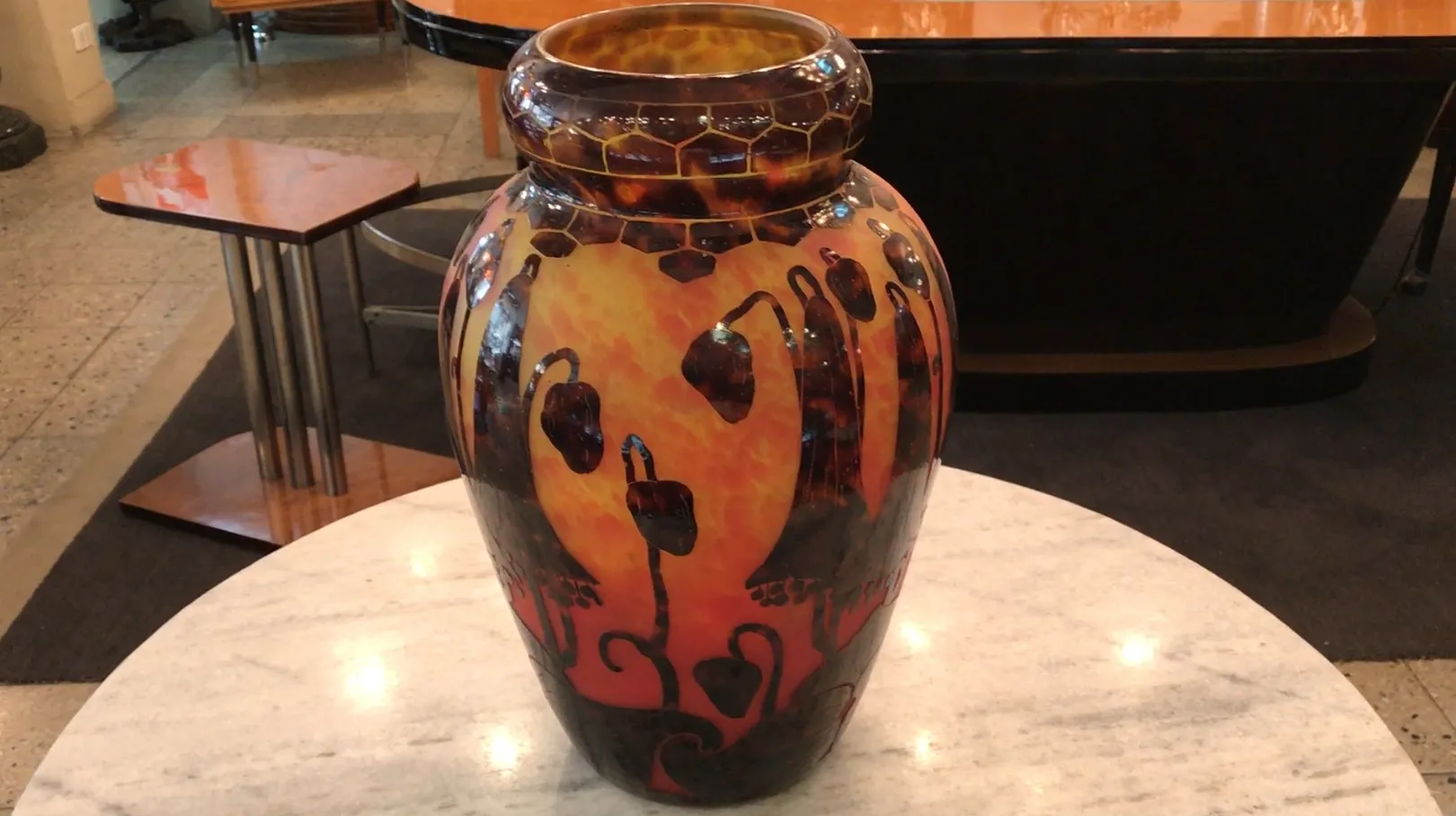 Antique vase with colorful patterns and unique design.