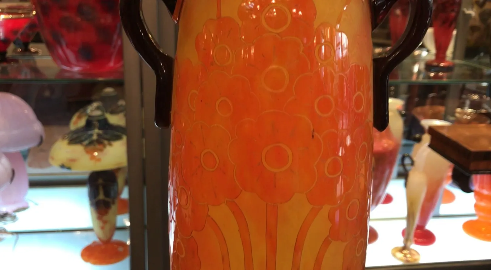 Antique signed glass Le Verre with vibrant floral design.