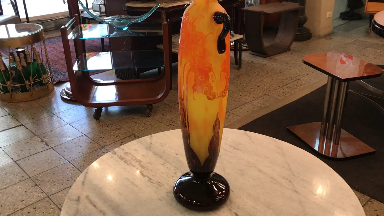 Old signed glass Le Verre with bright orange background.