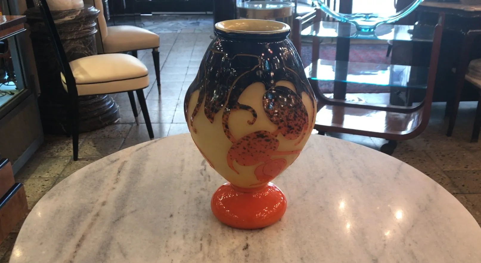 Antique signed glass with distinctive design and orange base.