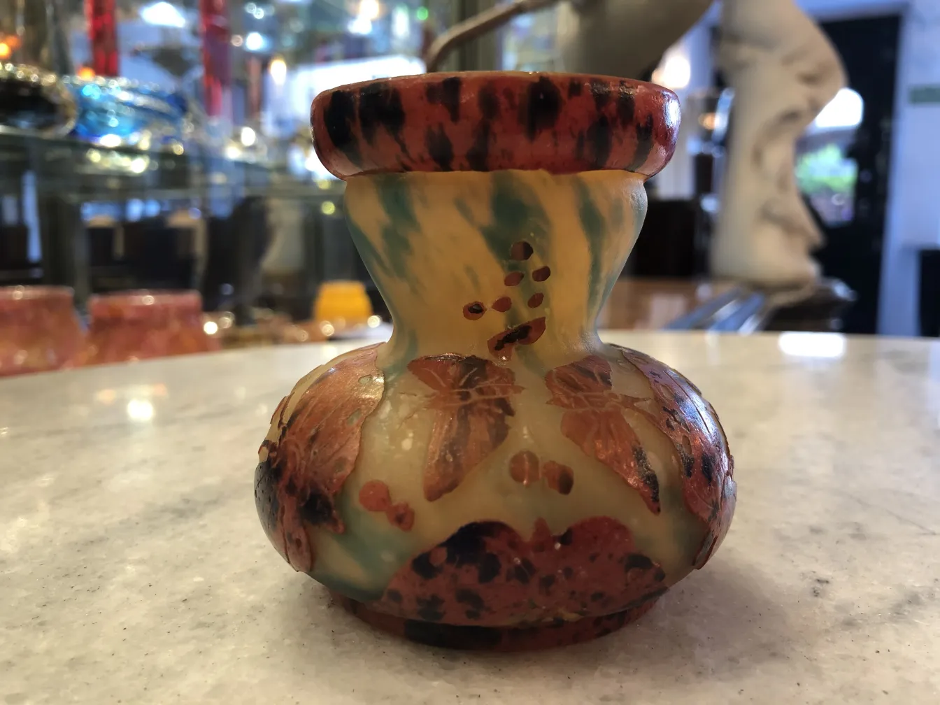 Antique signed glass Le Verre featuring floral decorations.