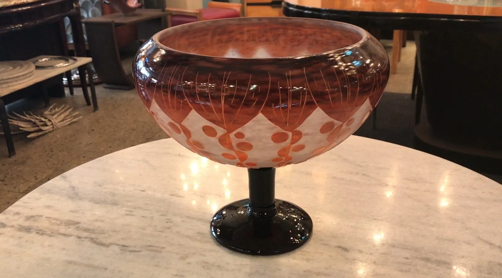 Antique glass featuring ornate design on black base