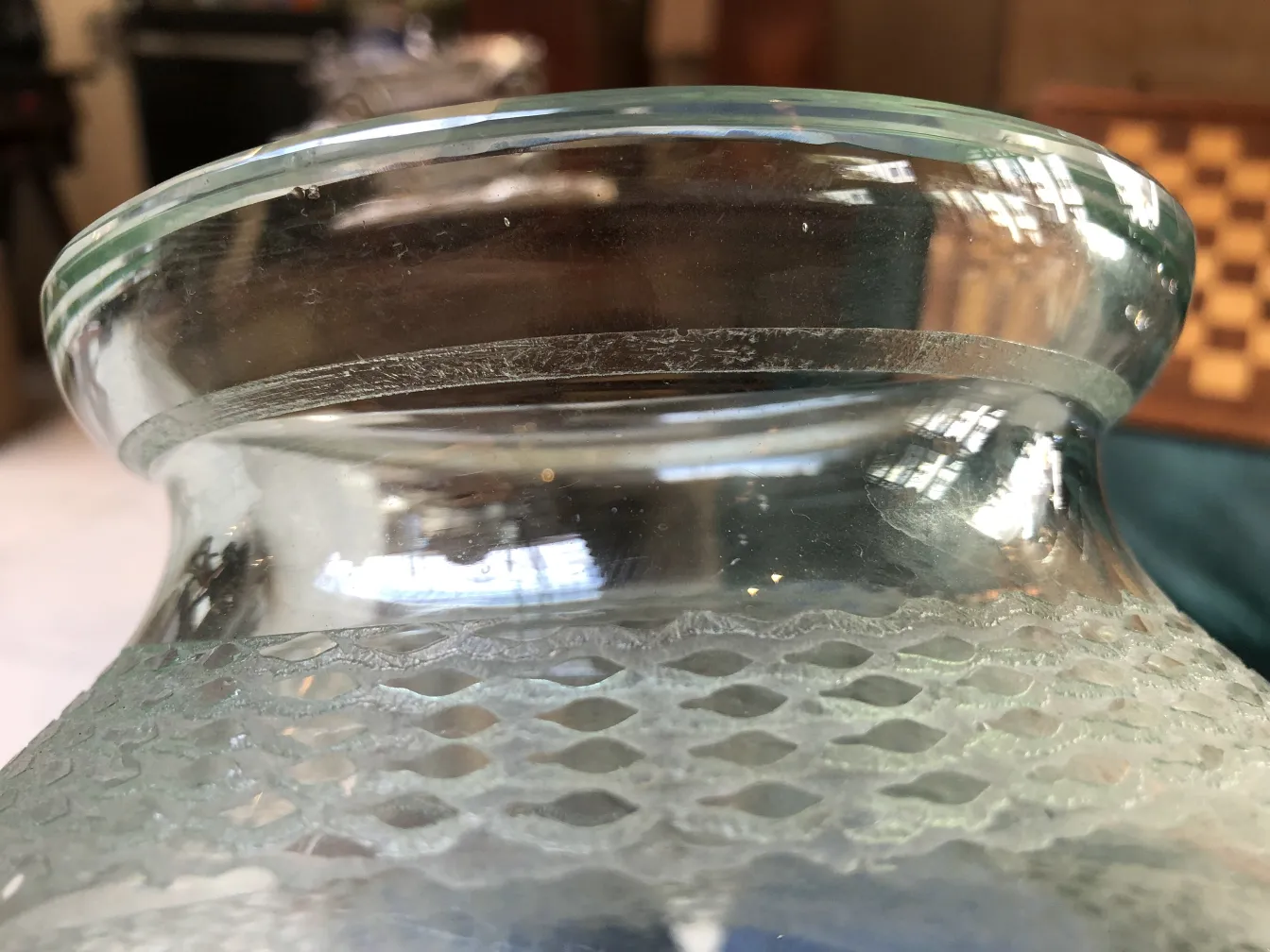 Detailed view of an antique signed glass Daum Nancy in a decorative setting.