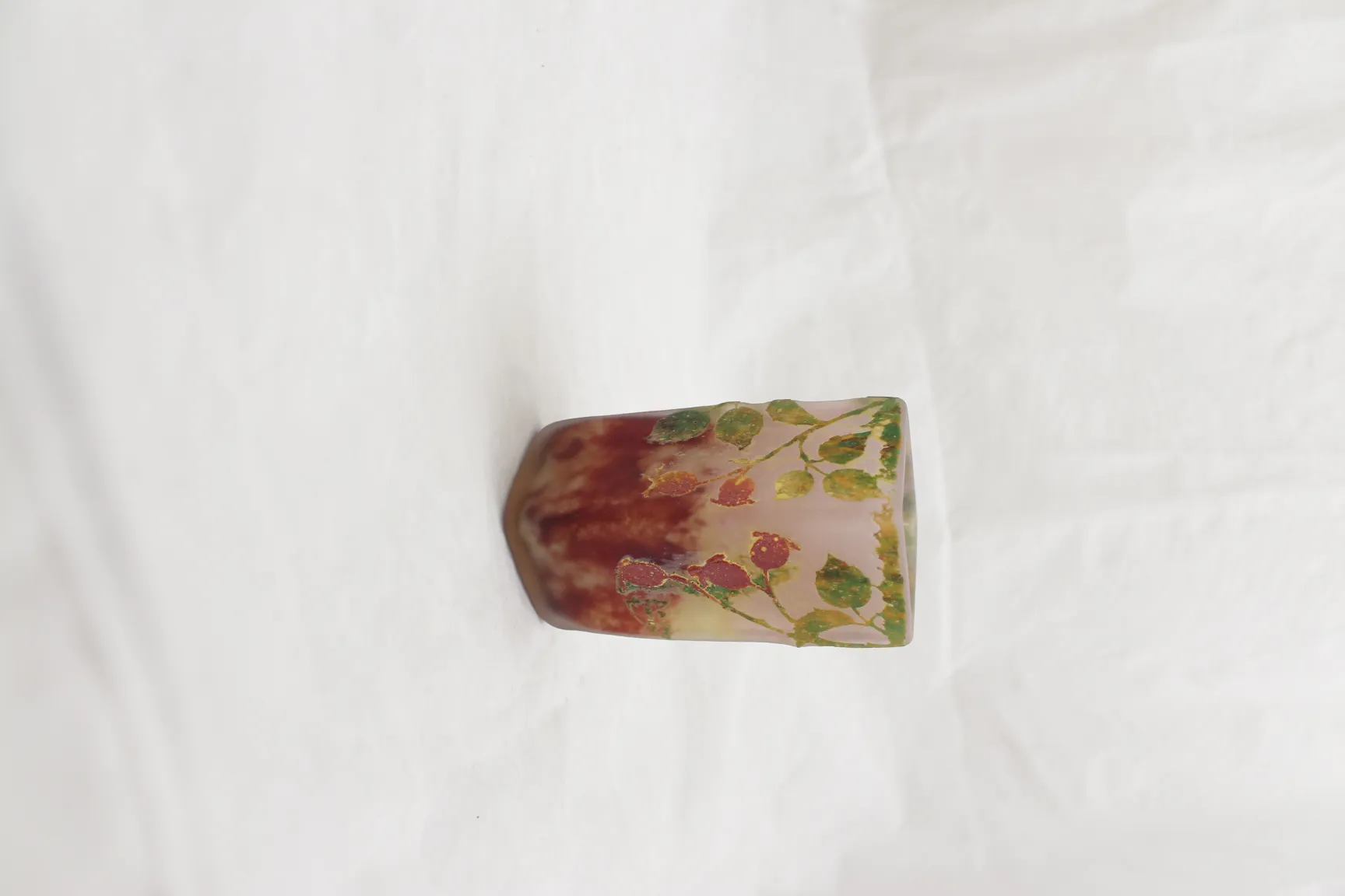 Signed glass Daum Nancy featuring painted leaves in natural colors