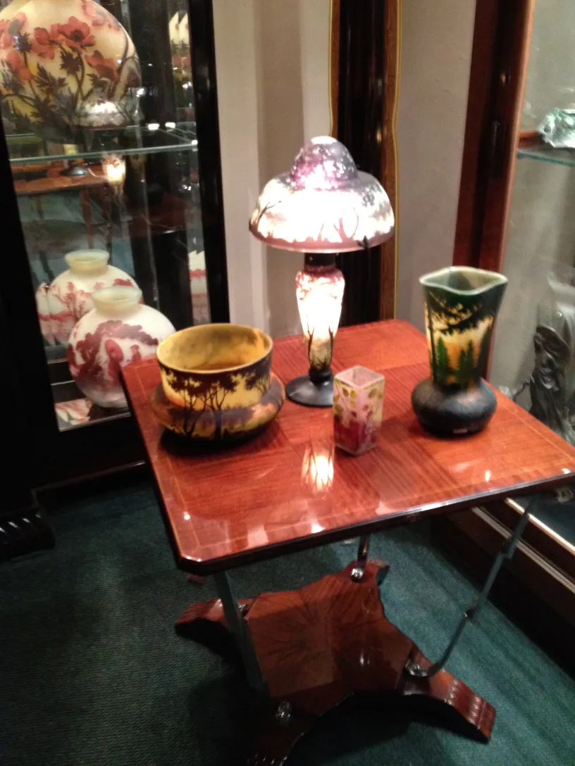 signed glass daum nancy displayed in an antique setting