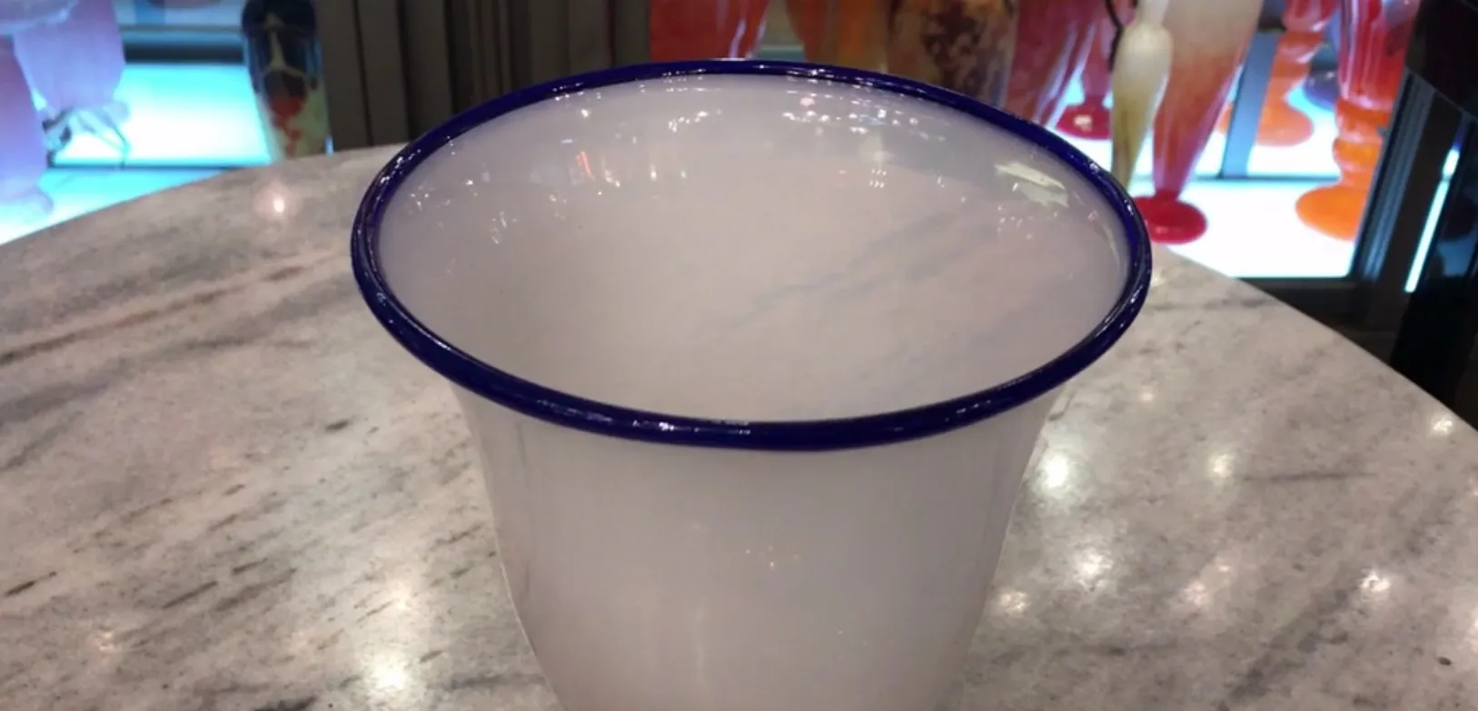 Signed glass from Daum Nancy with blue rim