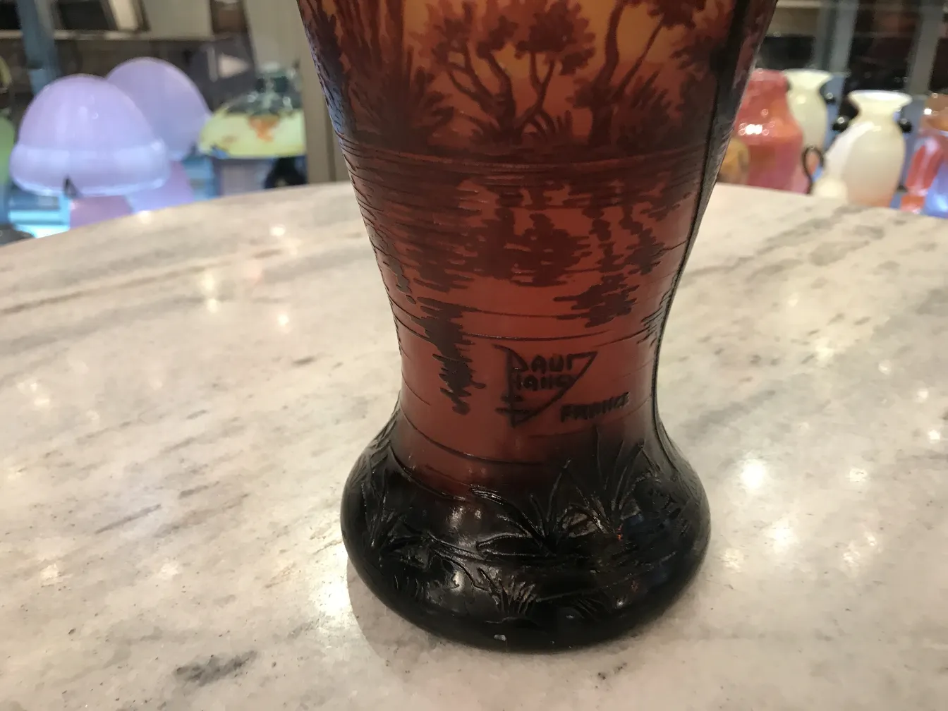 Antique signed glass by Daum Nancy featuring landscape and detailed base.
