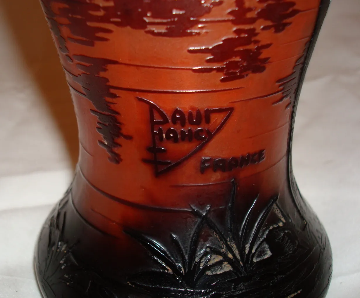 Antique signed glass Daum Nancy featuring engraved landscapes in amber.