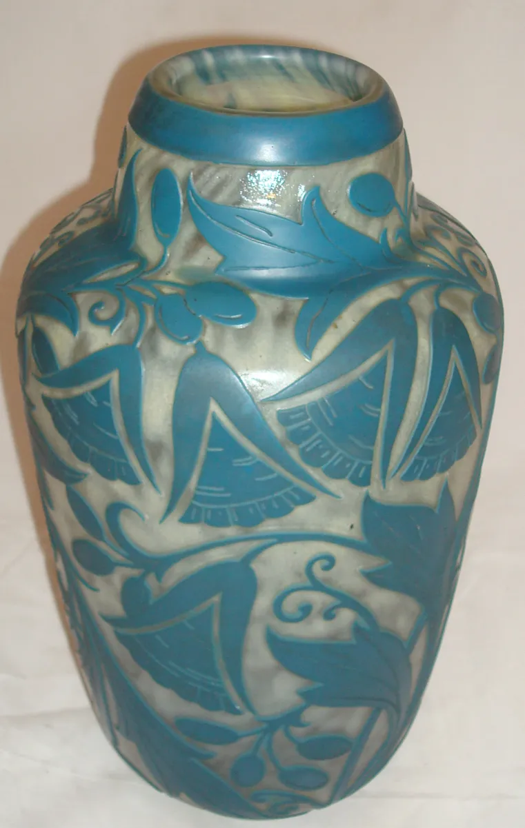 Antique signed vase with blue details on a light background